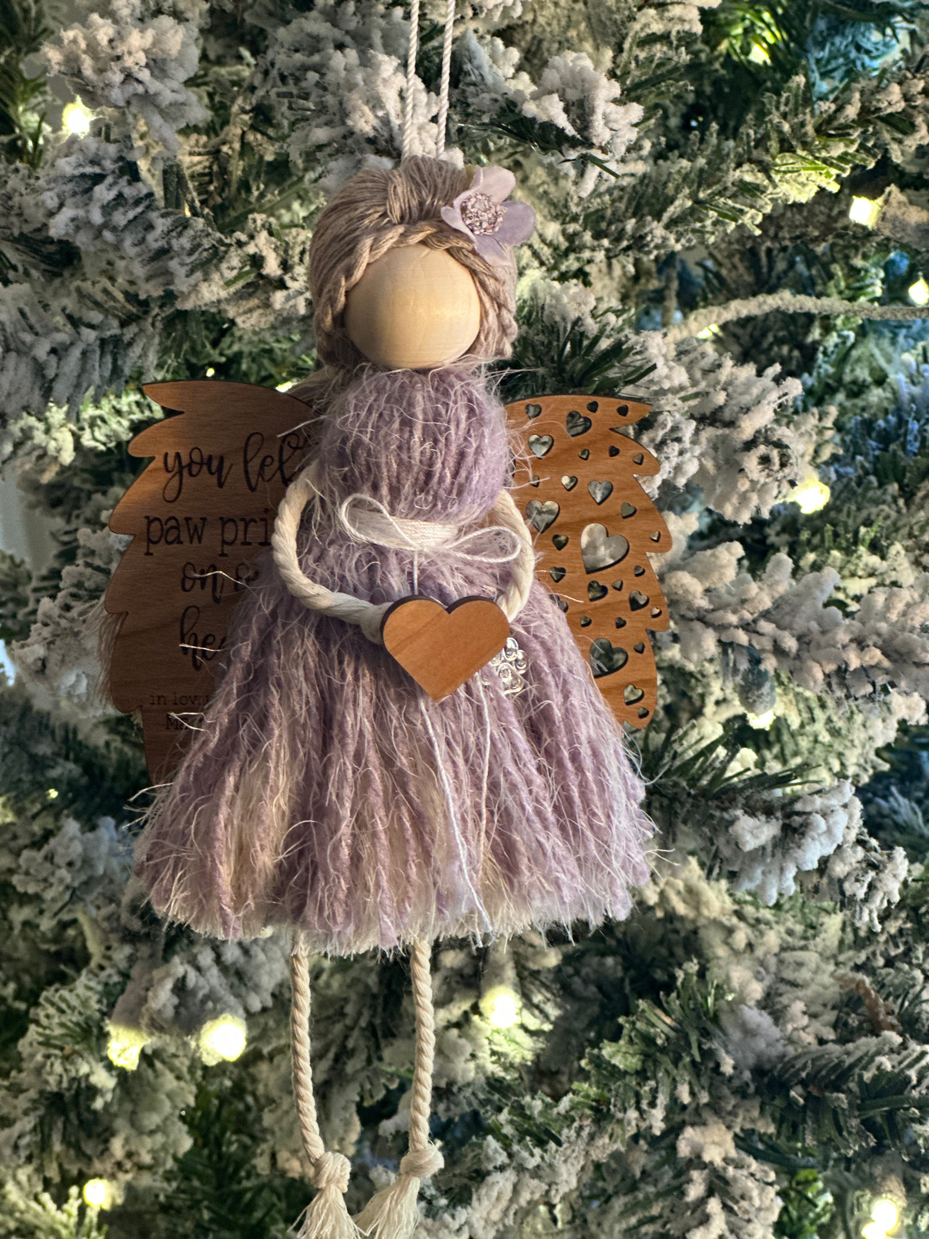 This is an memorial angel for an animal with the engraved words You left paw prints on our hearts: In loving memory of (pets name + date).