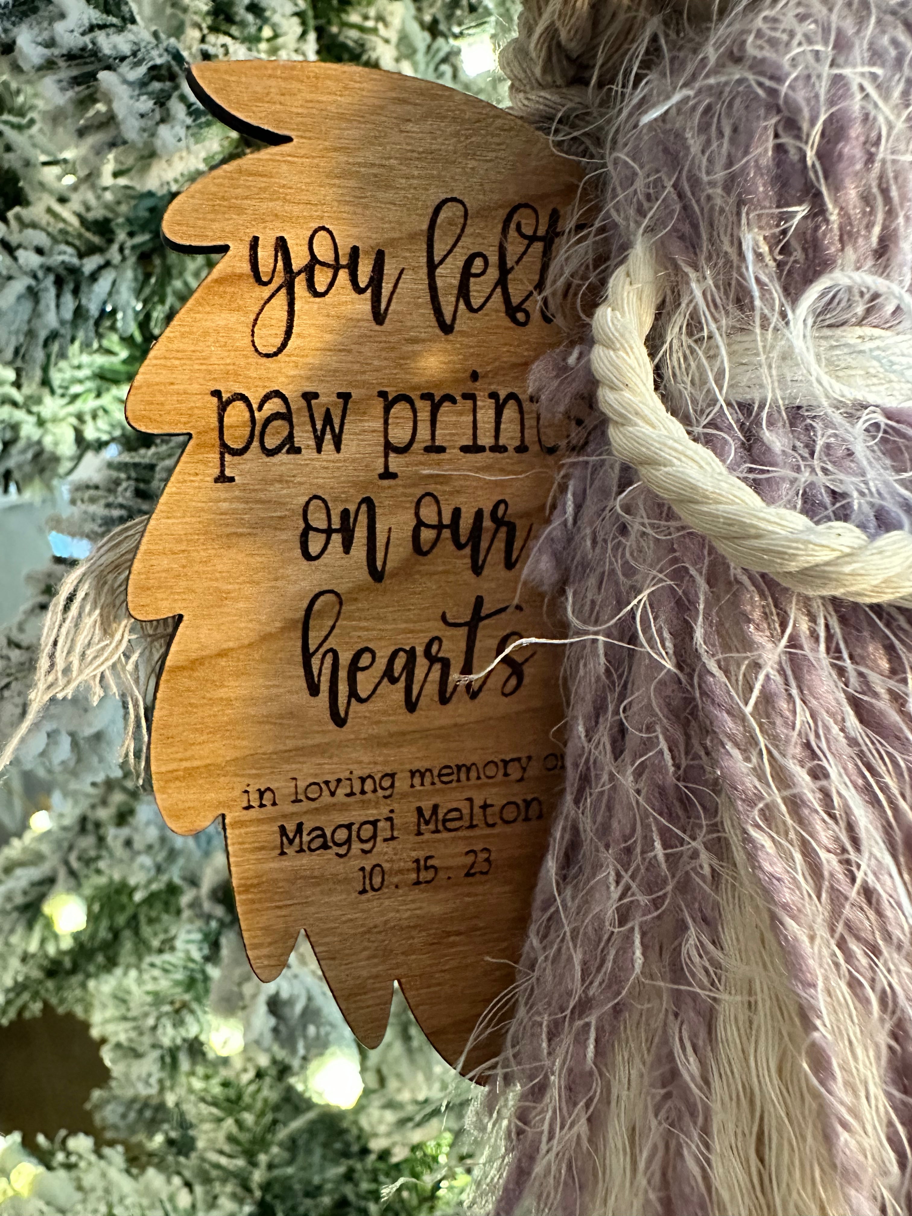 This image shows a close of of the engraved saying on the angel wing.