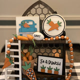 This carrot patch 3D decor comes as a set. Cathedral tiered tray not included. Set comes with 1 5x5 blue vintage 3D truck, 1 5" round shiplap 3D carrot sign, 1 35" orange and white beaded garland with twine tassels, 1 5 cent a bunch (4x6") 3D frame sign, 1 3D buffalo plaid carrot ( 5.5x2") and a 9" wood ladder.