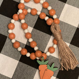 This is the 35" beaded garland with wooden carrot tassel on one end and twine tassel on the other.