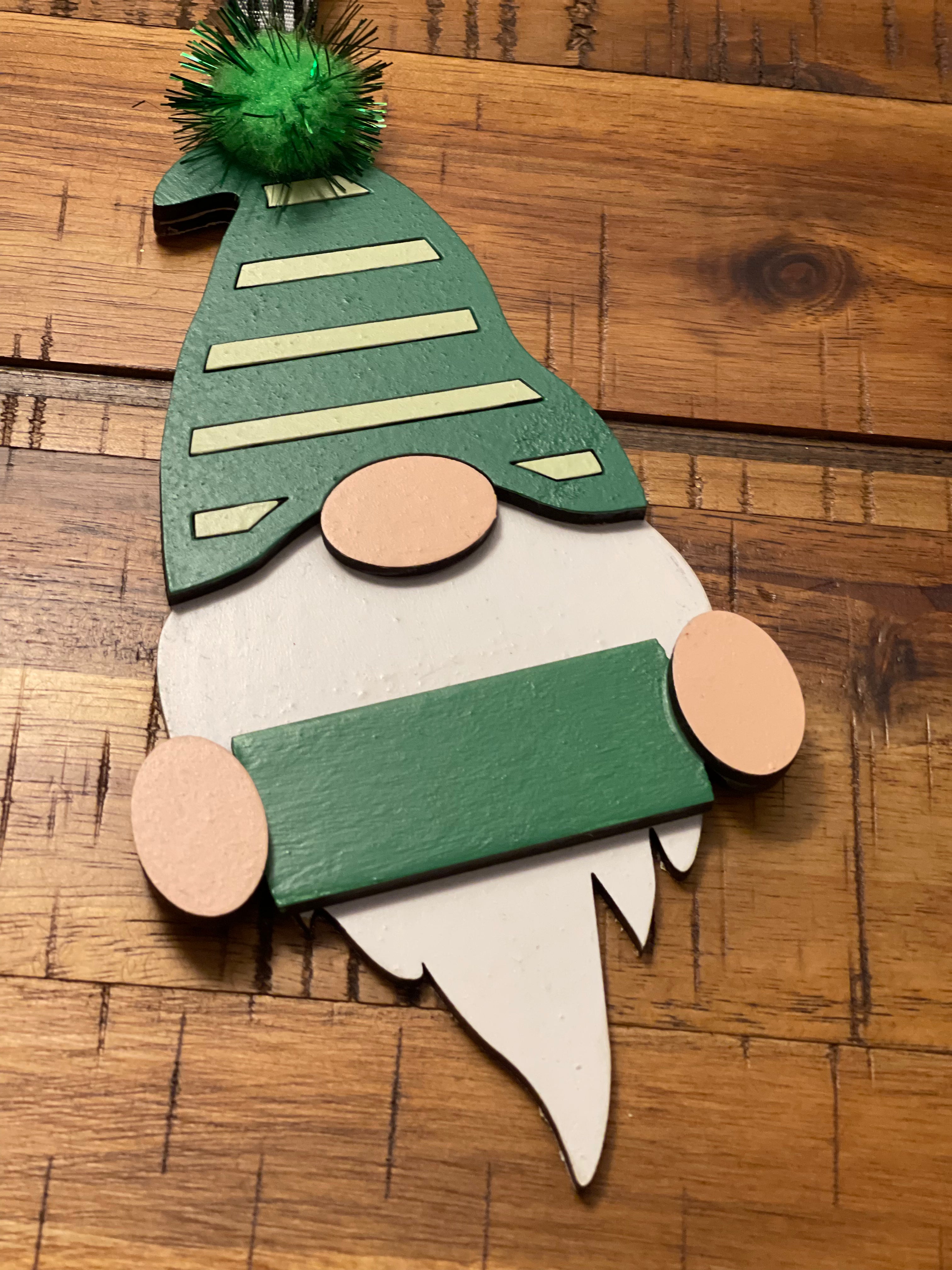 This is the green gnome displayed on a wood table.