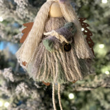 This is the sage macrame angel with blonde hair holding her baby with the walnut wood angel wings.