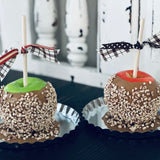 This image shows a picture of both the red and green apples.  These are not edible, and are only for decor use.  Each faux caramel apples come with fake peanuts that are attached to the apple.  You can add scented oil drops to fragrant any room.  Add drops of your favorite oil to the stem.  Enjoy!