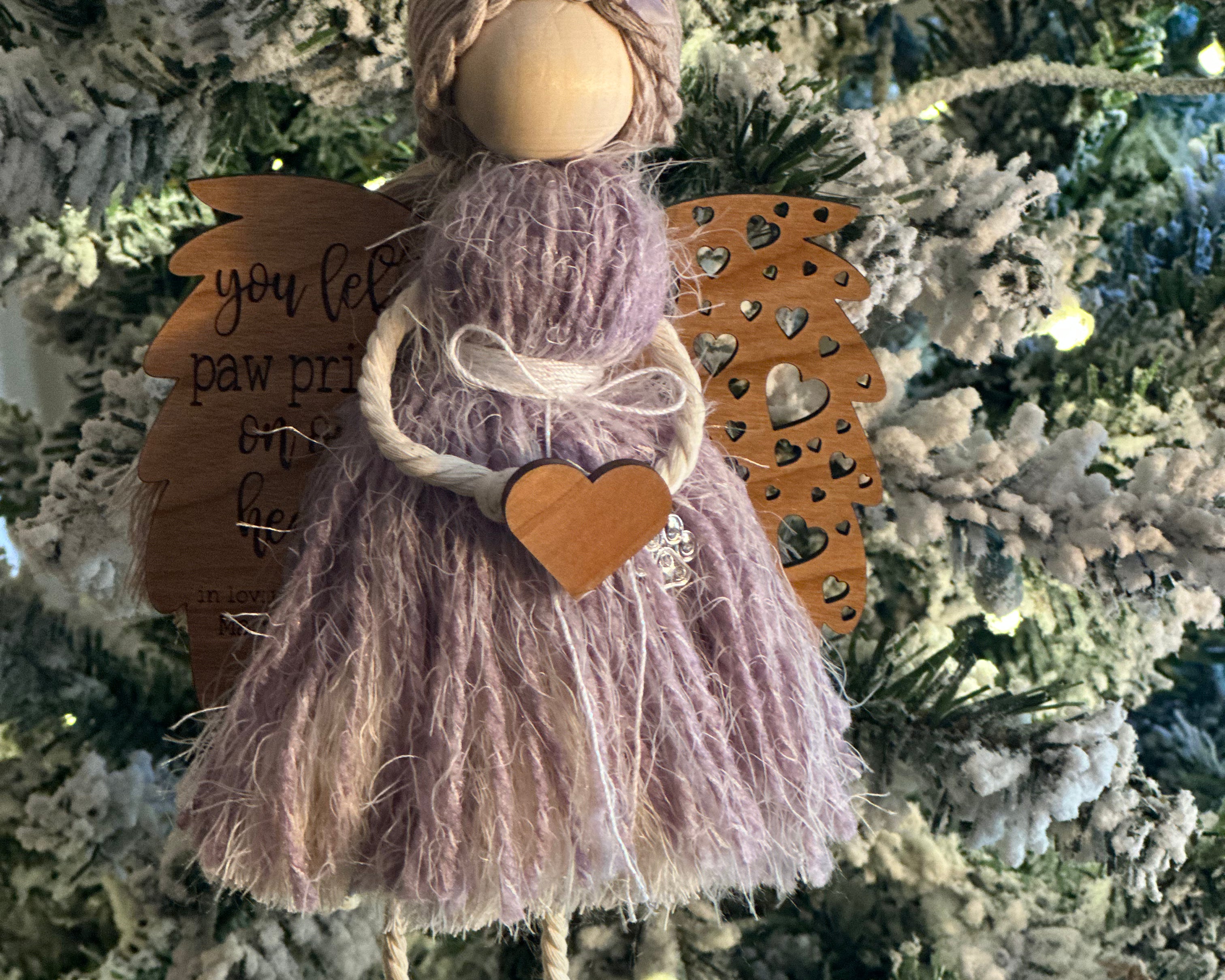 This is an memorial angel for an animal with the engraved words You left paw prints on our hearts: In loving memory of (pets name + date).