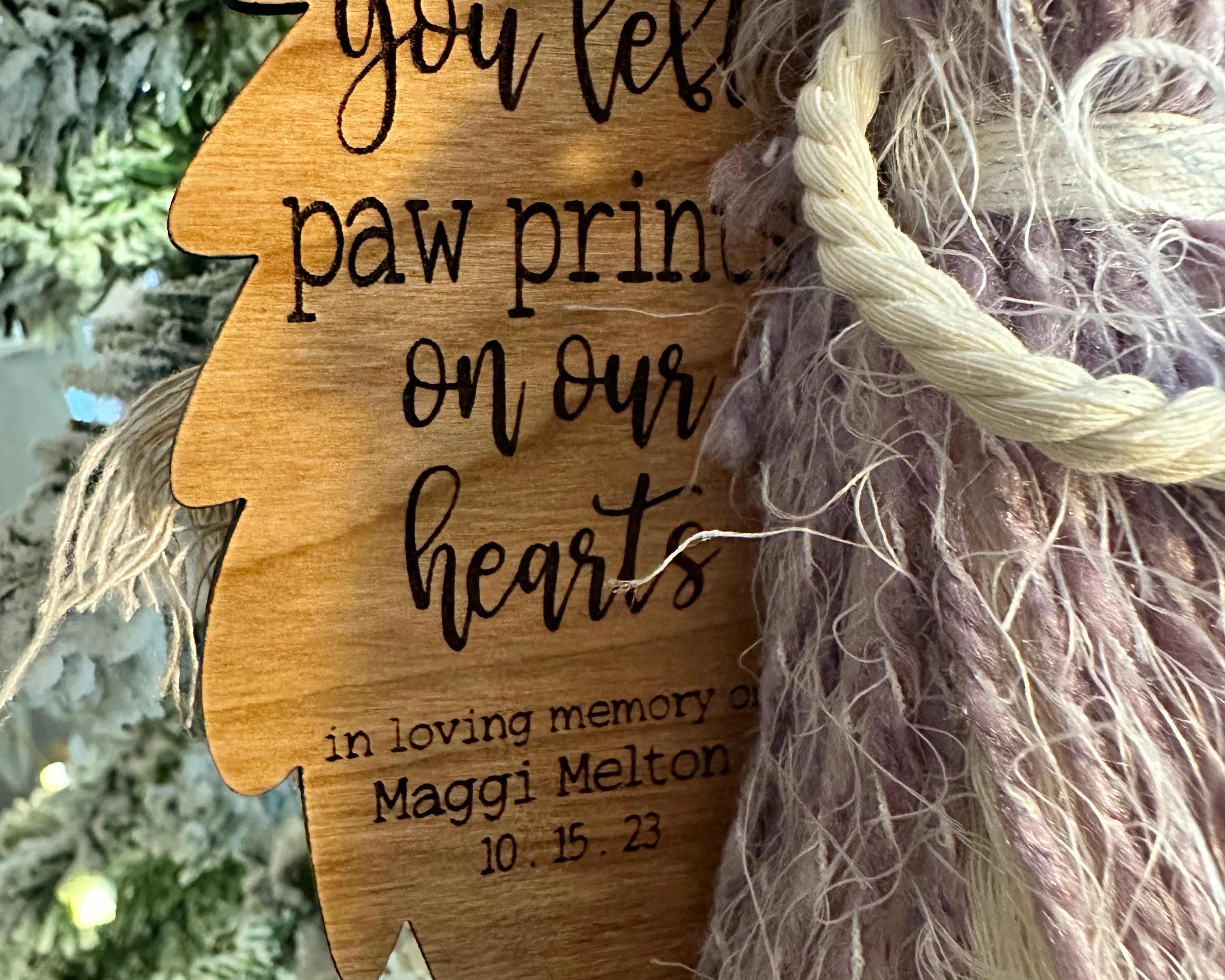 This image shows a close of of the engraved saying on the angel wing.