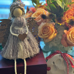 This image shows the angel sitting on the memorial pet box.