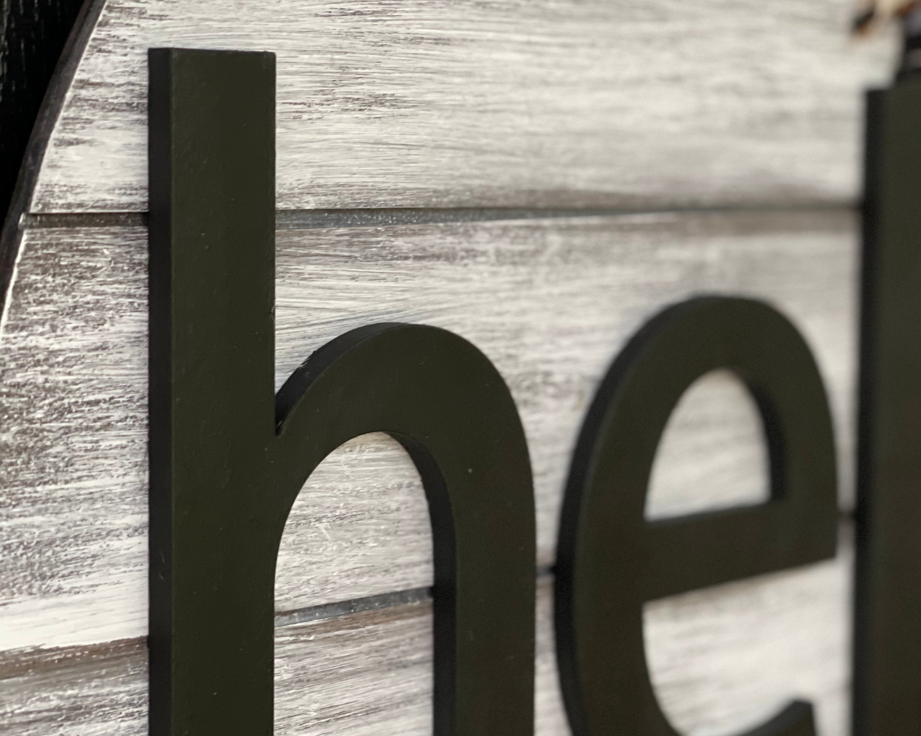 This image sows a close up of the wood cutout lettering.
