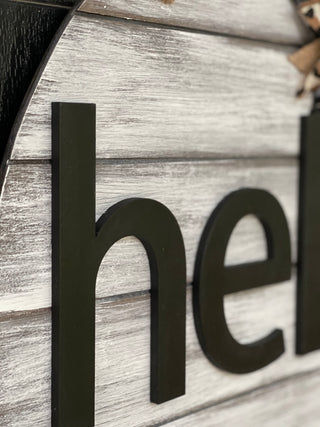 This image sows a close up of the wood cutout lettering.
