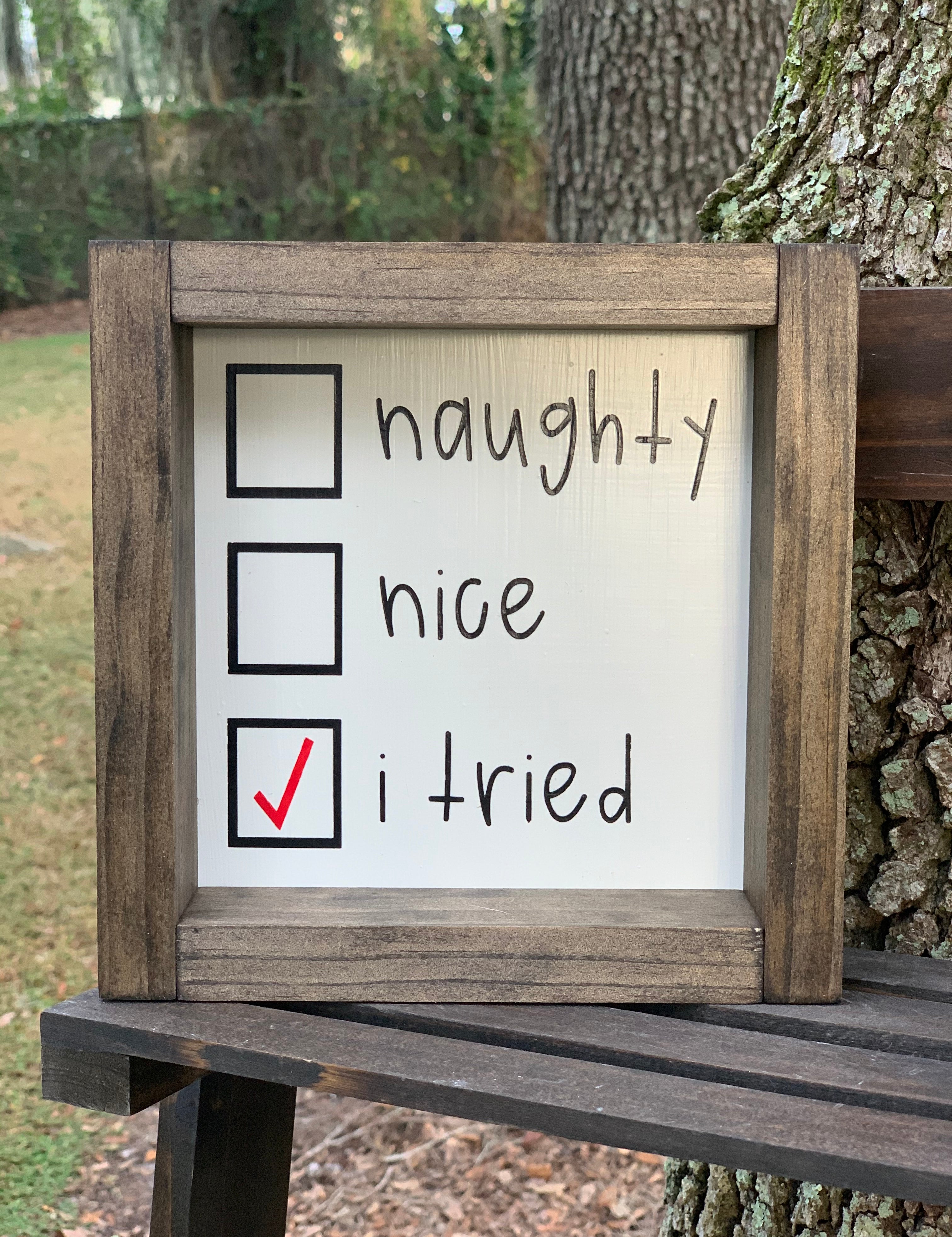 This image shows the Naughty, Nice, I Tried sign by itself.  There is a red check mark in the box for I tried.