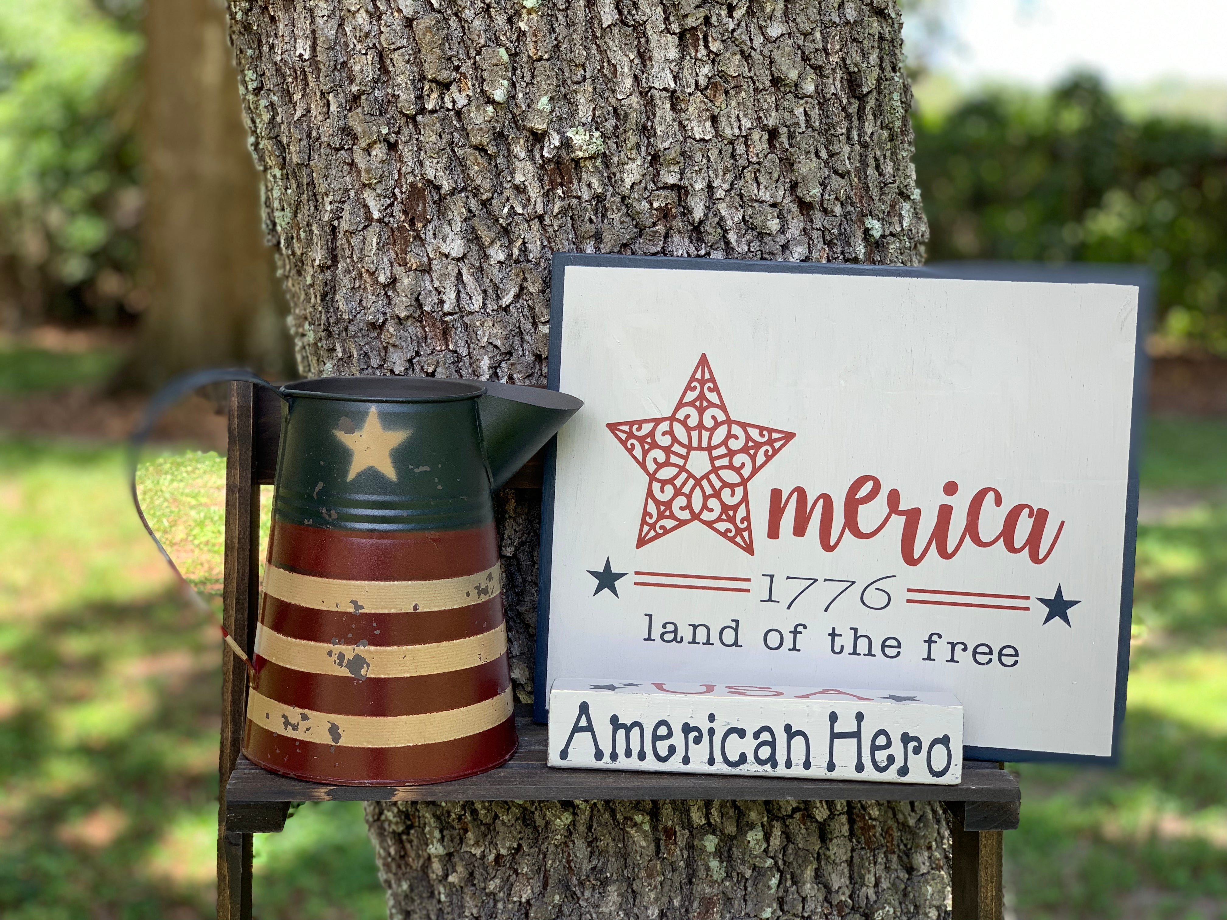 Primitive Red, Tan, and Navy Metal Pitcher is shown with the July sign of the month.  Each item sold separately.