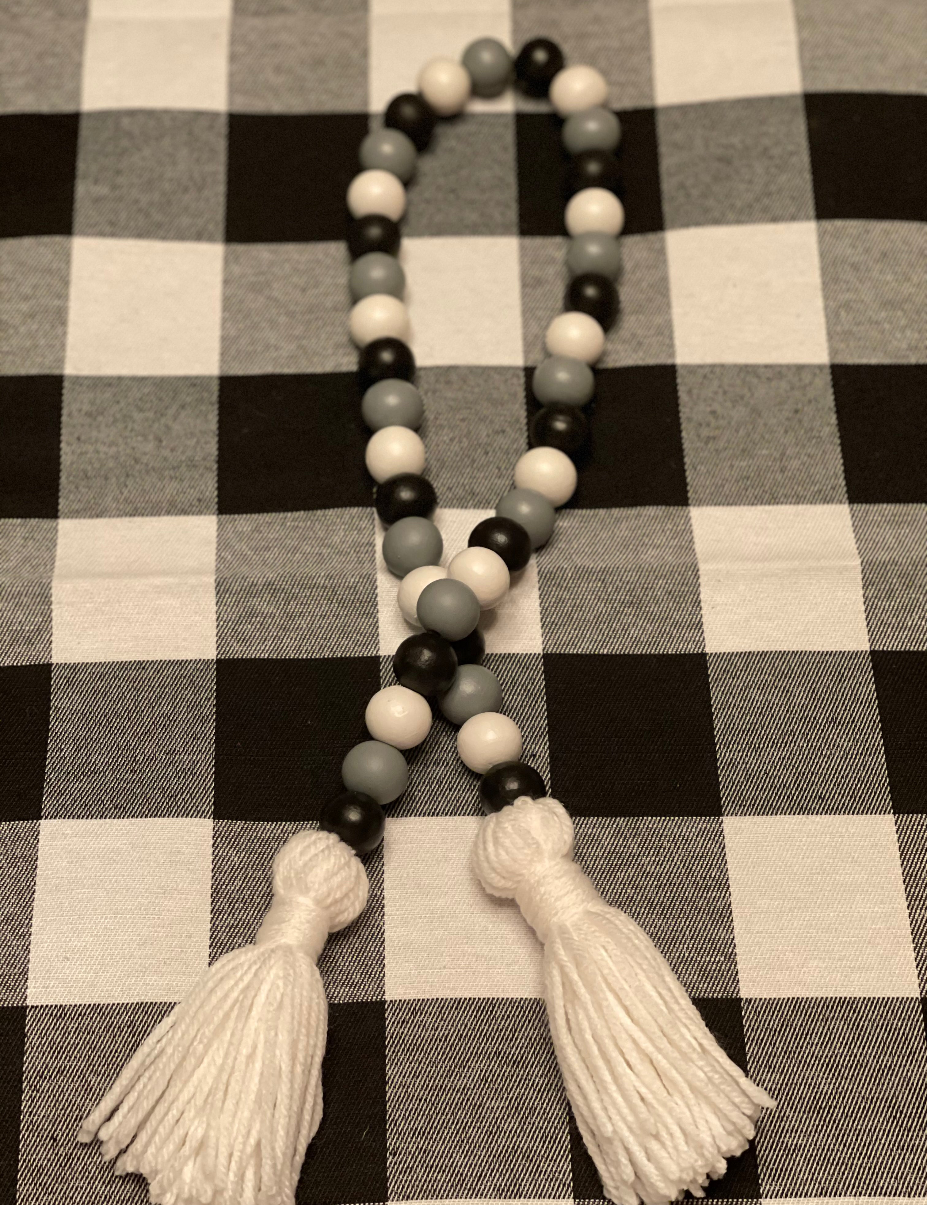 The buffalo plaid bead garland is showing the  35".