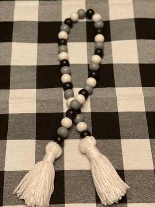 The buffalo plaid bead garland is showing the  35".