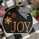 This image shows the large black Joy ornament.