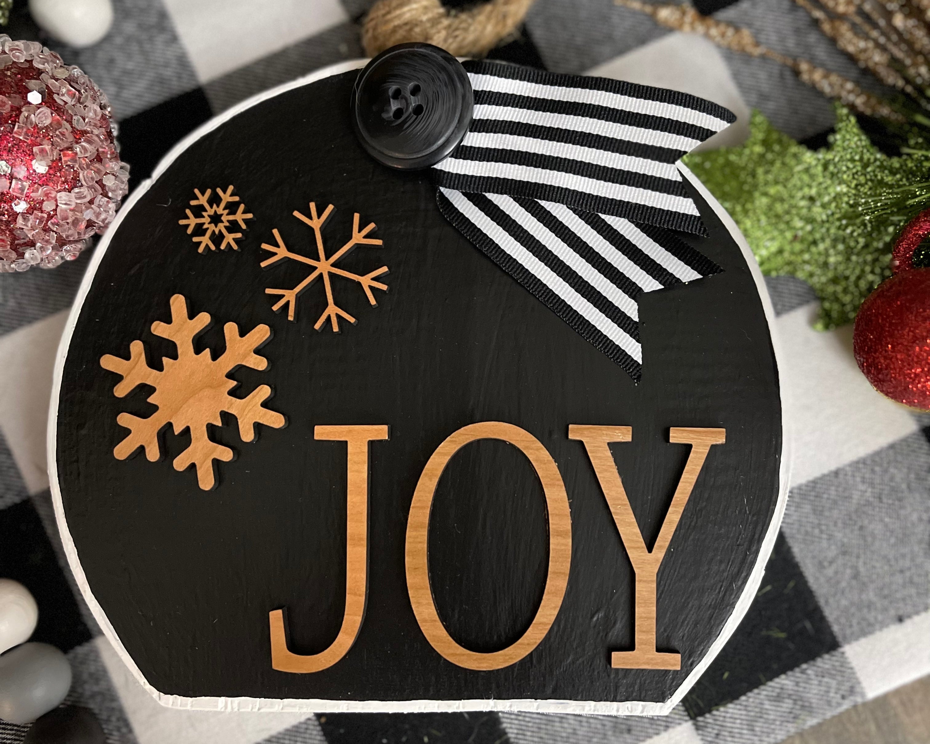 This image shows the large black Joy ornament.