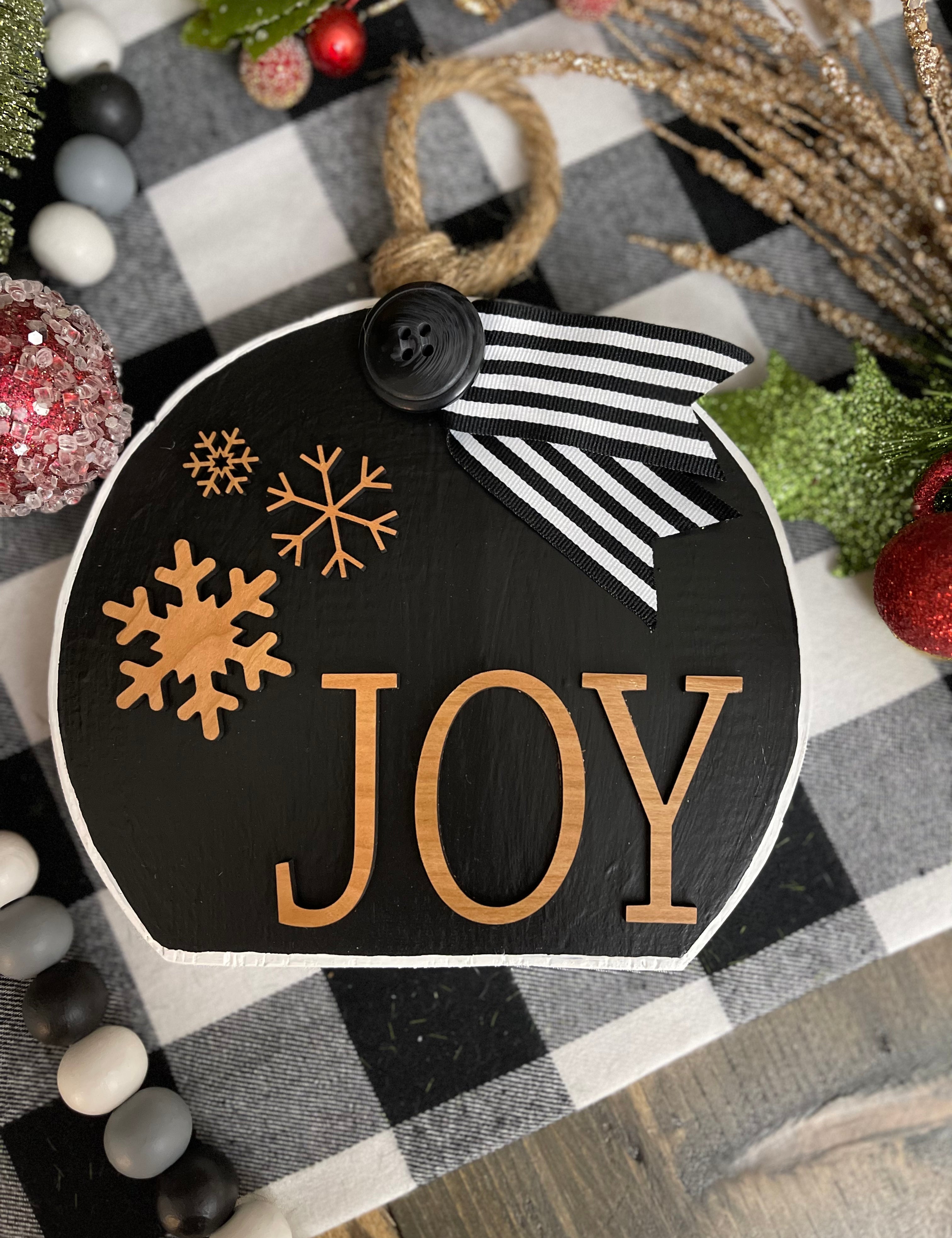 This image shows the large black Joy ornament.