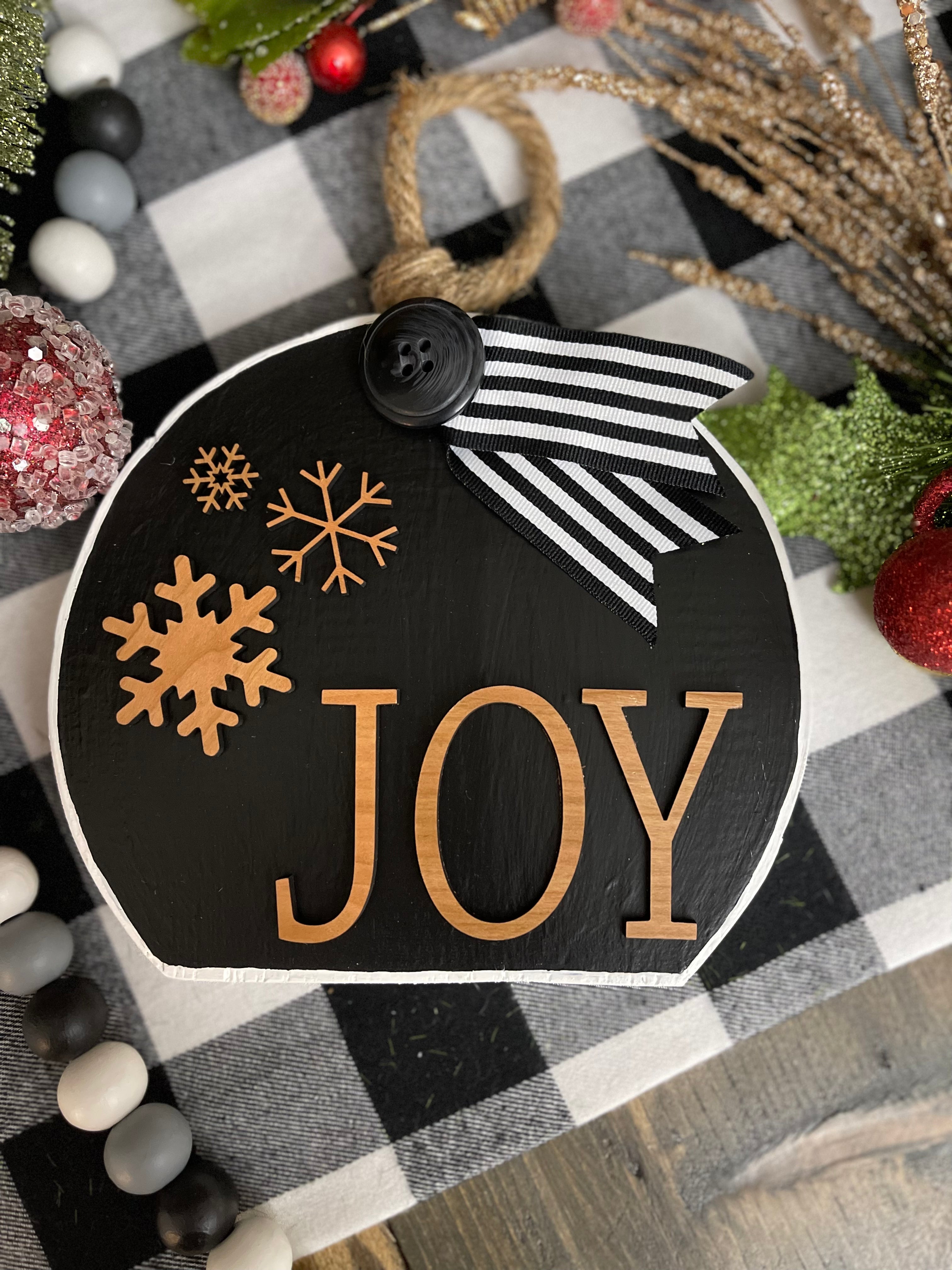 This image shows the large black Joy ornament.