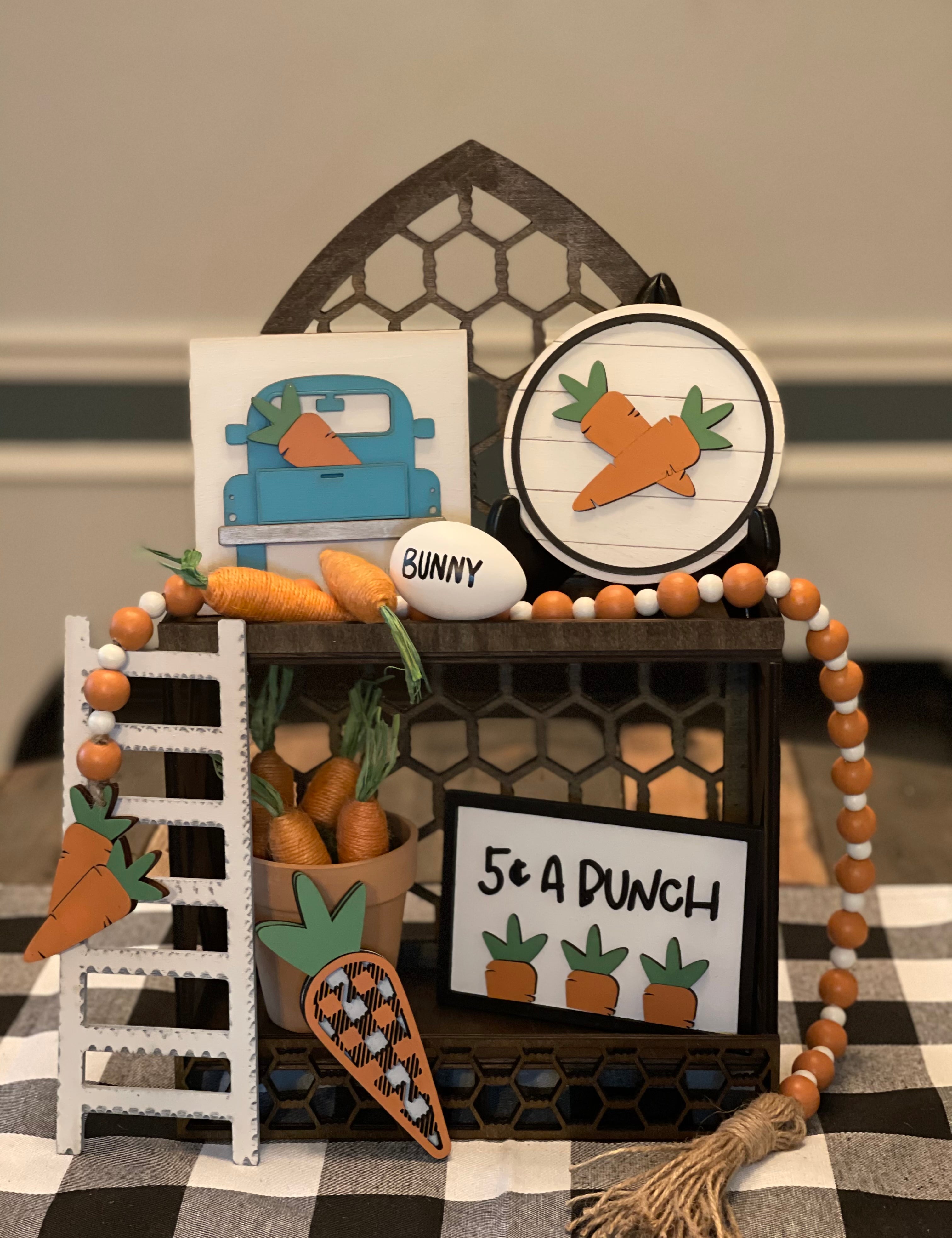 This carrot patch 3D decor comes as a set.  Cathedral tiered tray not included.  Set comes with 1 5x5 blue vintage 3D truck, 1 5" round shiplap 3D carrot sign, 1 35" orange and white beaded garland with twine tassels, 1 5 cent a bunch (4x6") 3D frame sign, 1 3D buffalo plaid carrot ( 5.5x2") and a 9" wood ladder.  