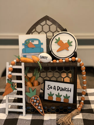This carrot patch 3D decor comes as a set.  Cathedral tiered tray not included.  Set comes with 1 5x5 blue vintage 3D truck, 1 5" round shiplap 3D carrot sign, 1 35" orange and white beaded garland with twine tassels, 1 5 cent a bunch (4x6") 3D frame sign, 1 3D buffalo plaid carrot ( 5.5x2") and a 9" wood ladder.  