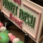 This is an alternative view of the sign showcasing the 3D lettering.