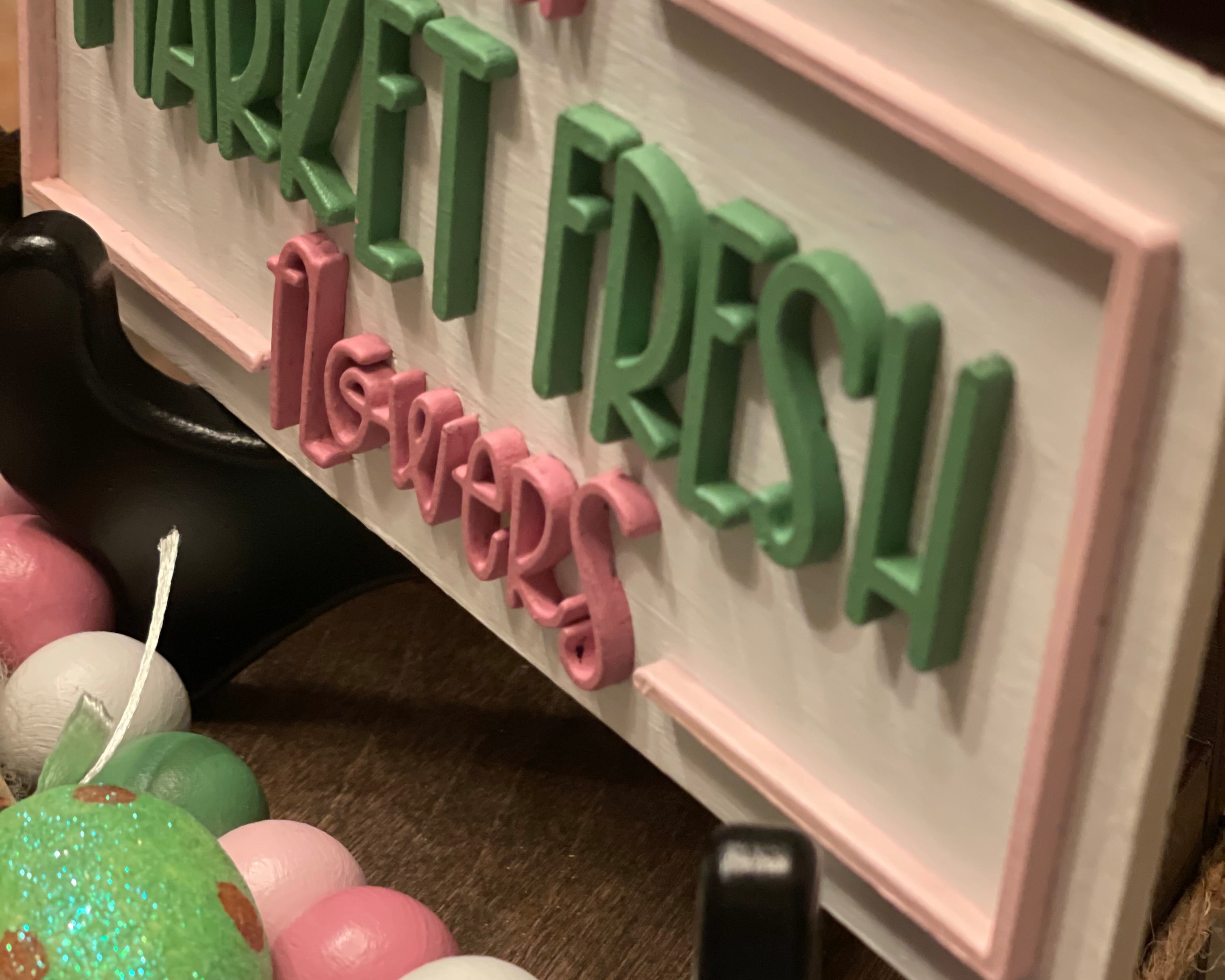 This is an alternative view of the sign showcasing the 3D lettering.