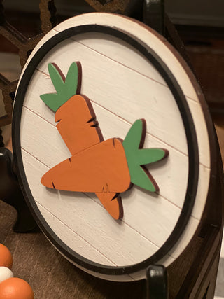 This is the 5" round 3D shiplap carrot sign shown as a side view.