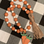 This is the 35" beaded garland with wooden carrot tassel on one end and twine tassel on the other.