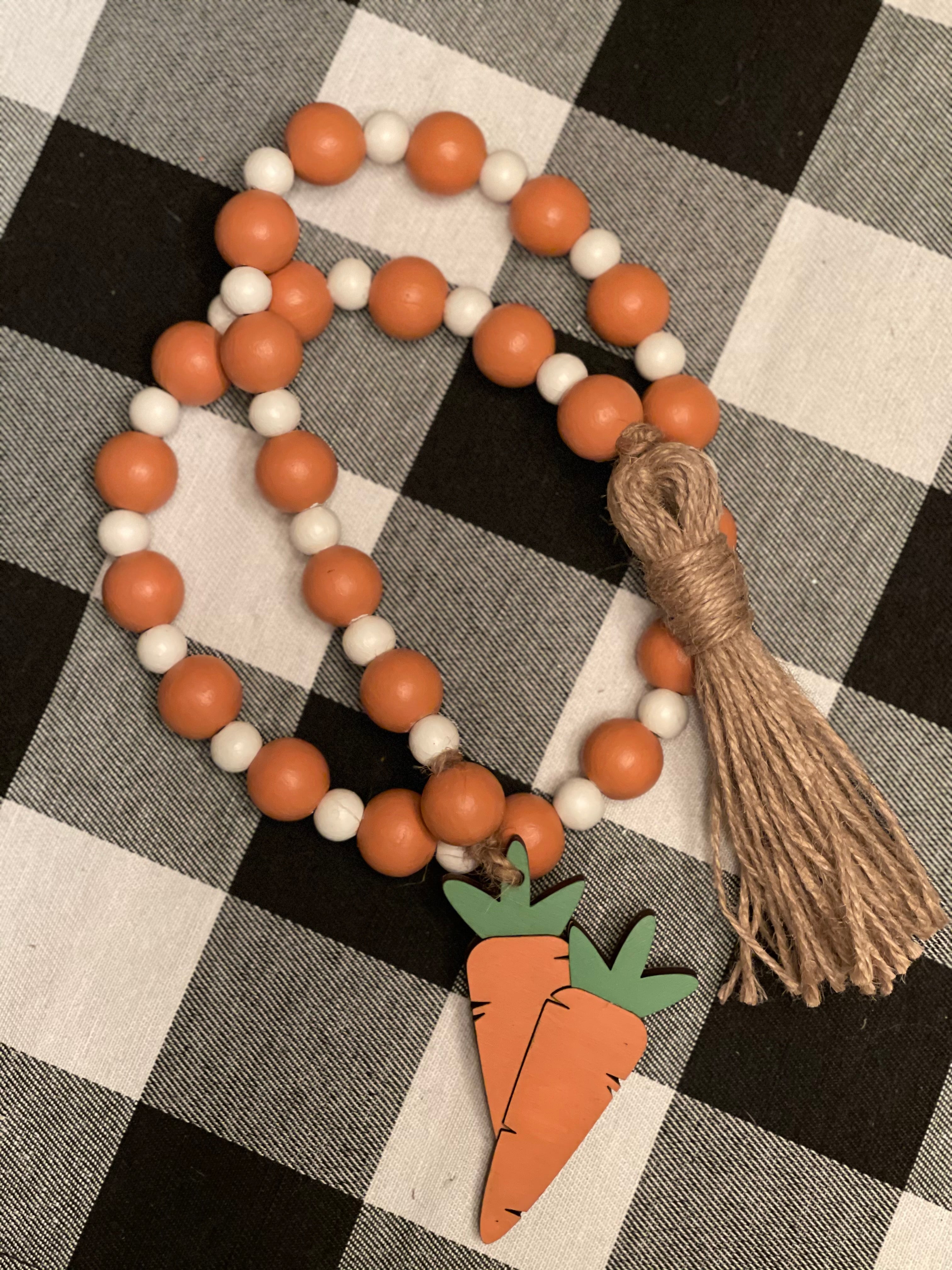This is the 35" beaded garland with wooden carrot tassel on one end and twine tassel on the other.