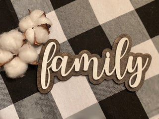 The family script sign is shown paired with mini cotton stems, not included with the sign.