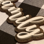 This is an alternate image of the family script sign showing the wood cutout.