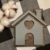 This image shows the mini house cutout sing displayed with mini cotton stems, not sold with product.