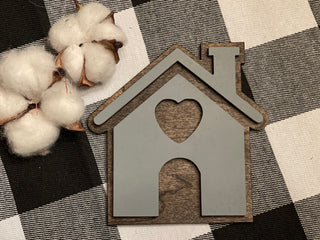 This image shows the mini house cutout sing displayed with mini cotton stems, not sold with product.