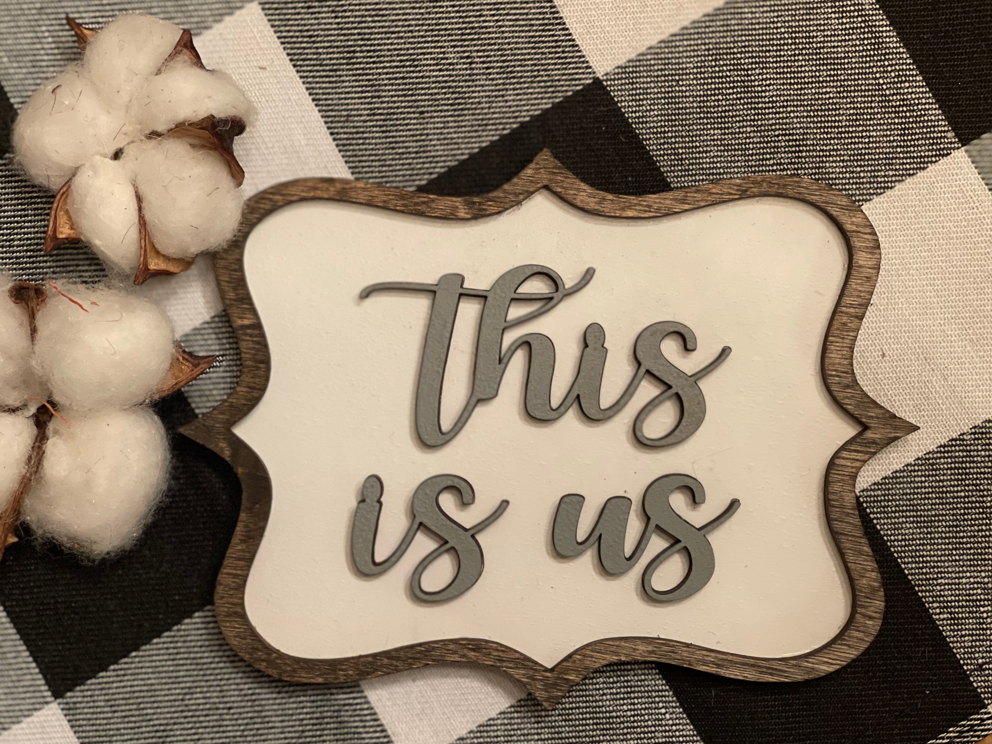 This Is Us mini tiered tray sign is shown paired with our mini cotton stem, which is not sold with the sign. This 3D mini sign makes the perfect addition to all your tiered tray year round decor items.