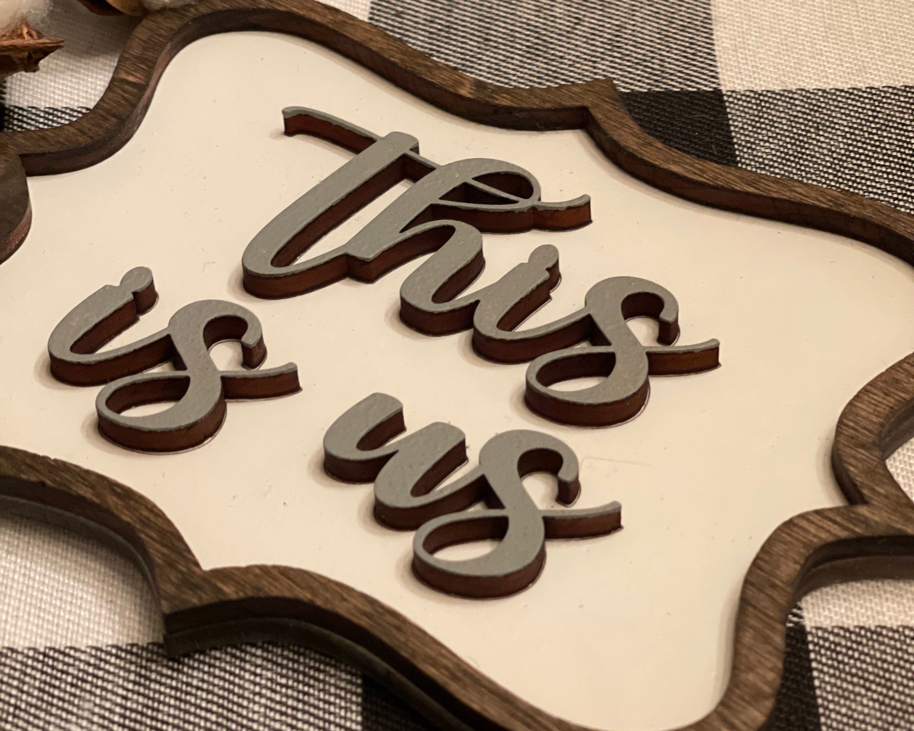This image showcases the raised wood on the mini sign.