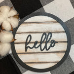Our 3D hello 5" round shiplap sign has a script hello wood cutout attached to the mini shiplap wood sign.  With a black cutout round wood boarder, this sign screams cuteness!  Add to any tiered tray, vignette, or shelf.  Works best with a mini easel, which is sold separately.