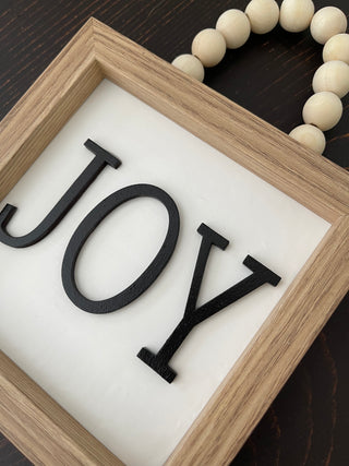 This image shows the JOY sign as a side profile.