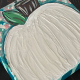 This image shows the textured hand painted teal pumpkin.