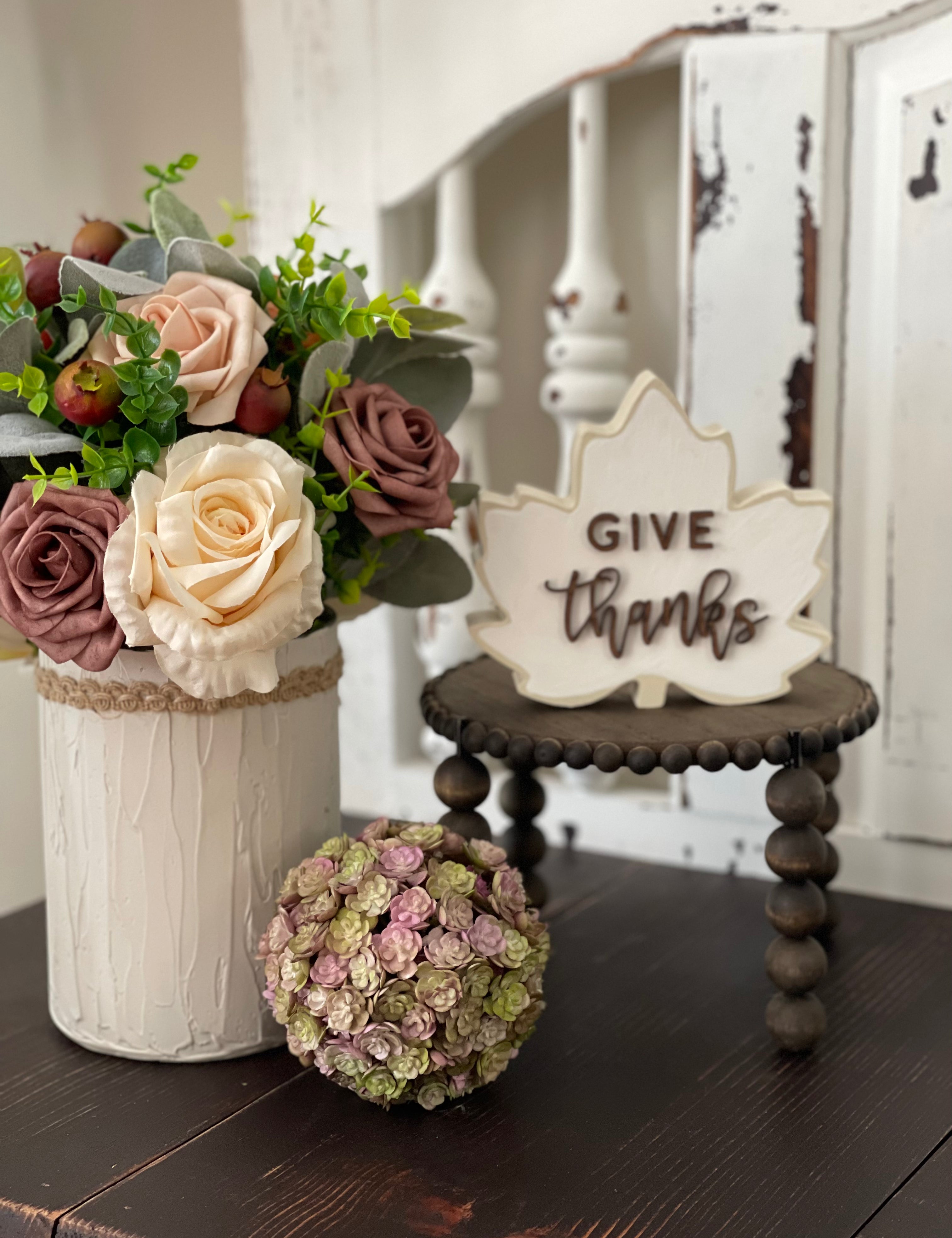 This image shows the Jacobean stand paired with various decor items. Each item sold separately.