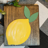 This image shows the stained wood block sign with the lemon 3D cutout.