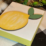 This image shows the side details of the white lemon block sign.