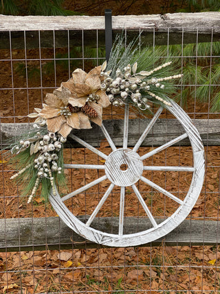 This gorgeous wagon wheel is shown outside hanging on a fence for display purposes only. Not recommended for outdoor use.