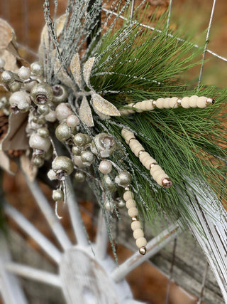 This is a close up of the pine greenery and beaded embellishments