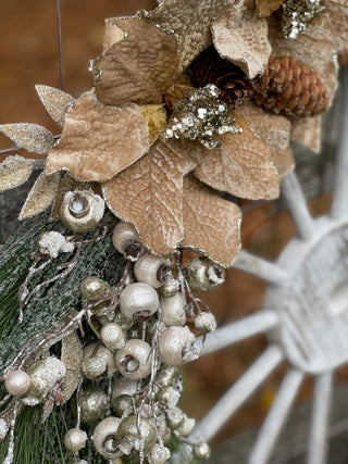 This image shows a close up of the flowers and pine greenery.