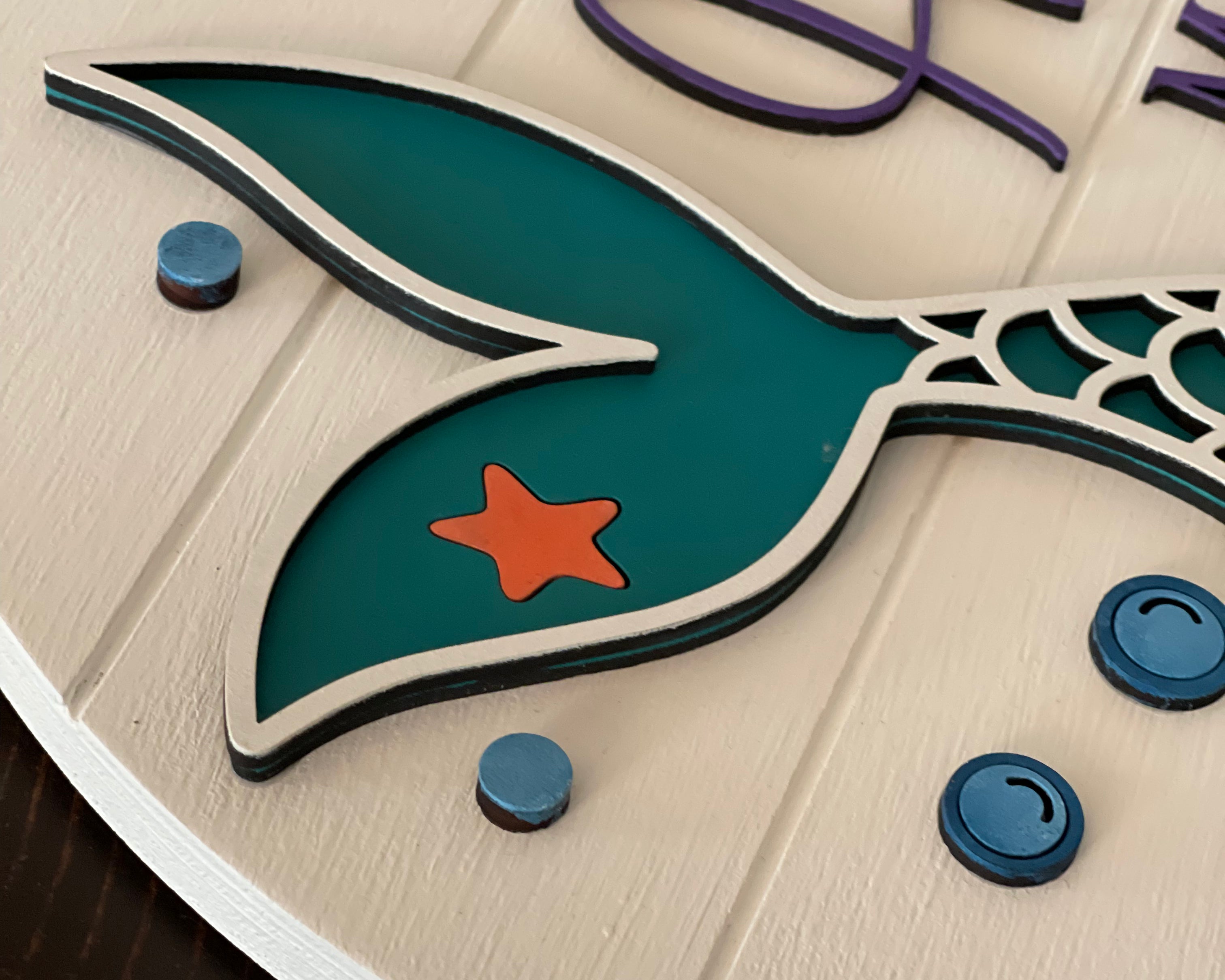 This image shows a close up of the 3D mermaid tail and bubles.