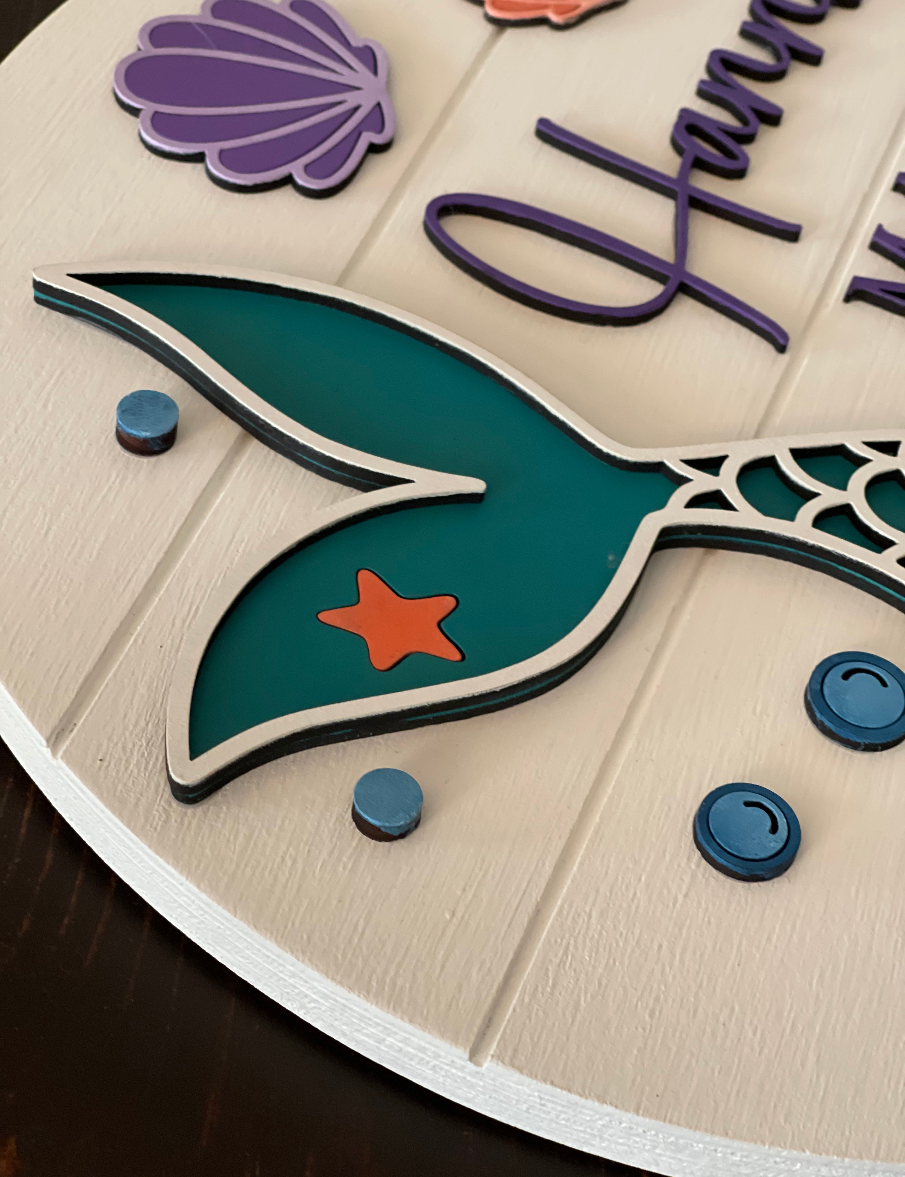 This image shows a close up of the 3D mermaid tail and bubles.