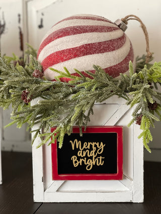 This image shows the merry and bright 3D lettering with red and white glitter ornament ball and pine greenery.