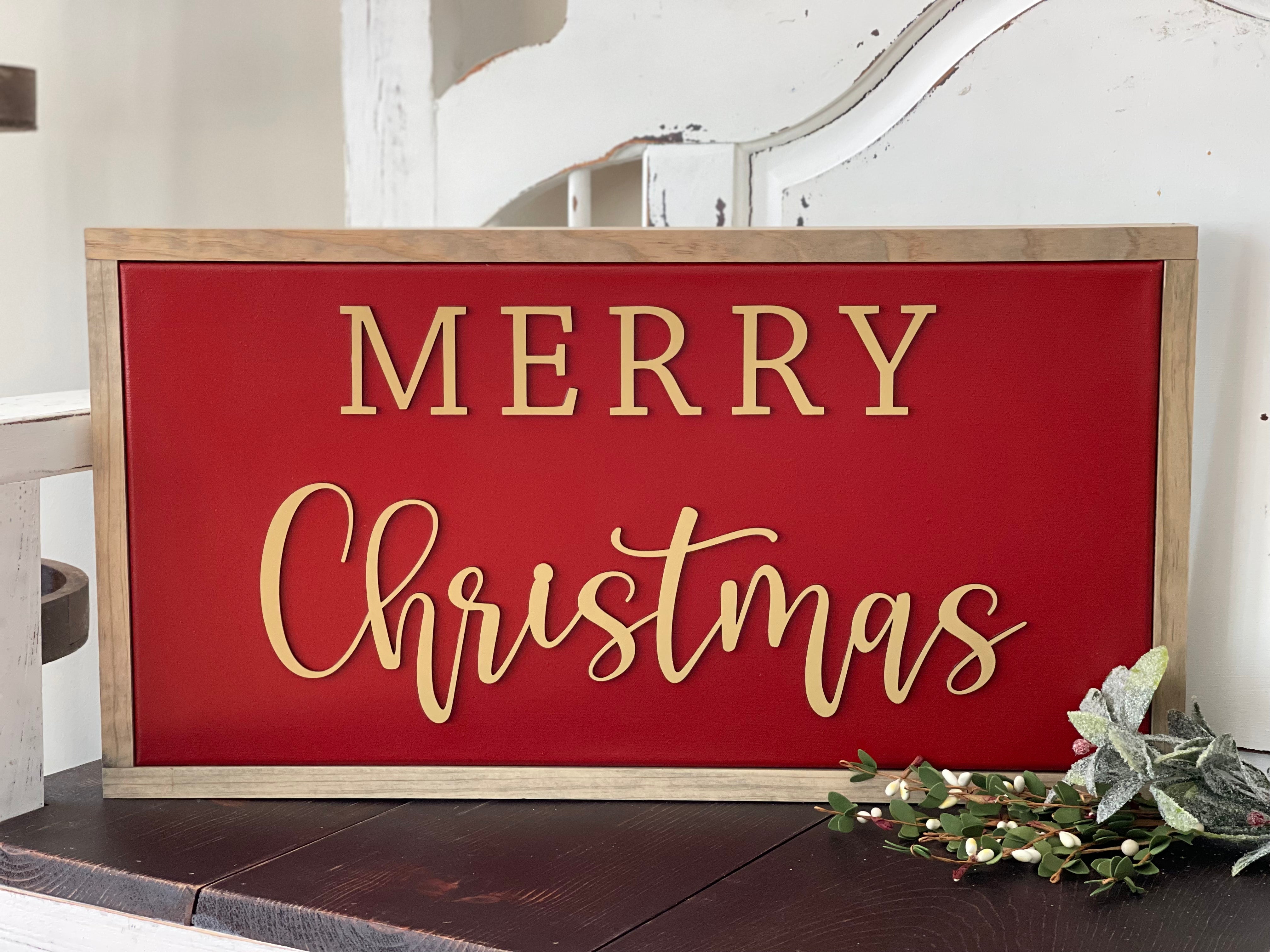 This is the red and tan Merry Christmas sign, displayed on a bench.