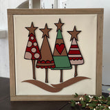 This image shows the Christmas tree sign displayed on a bench.