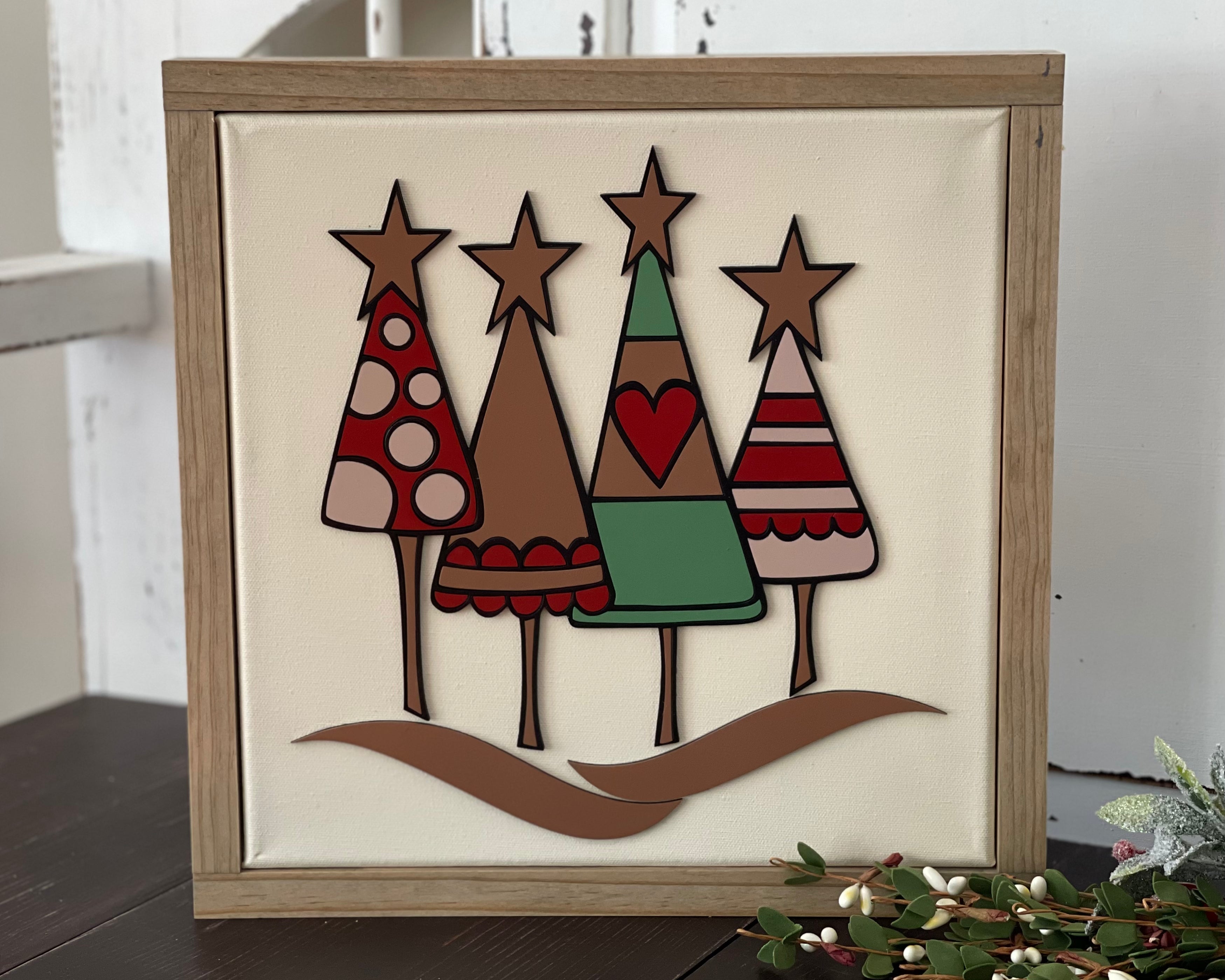 This image shows the Christmas tree sign displayed on a bench.