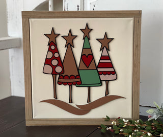 This image shows the Christmas tree sign displayed on a bench.