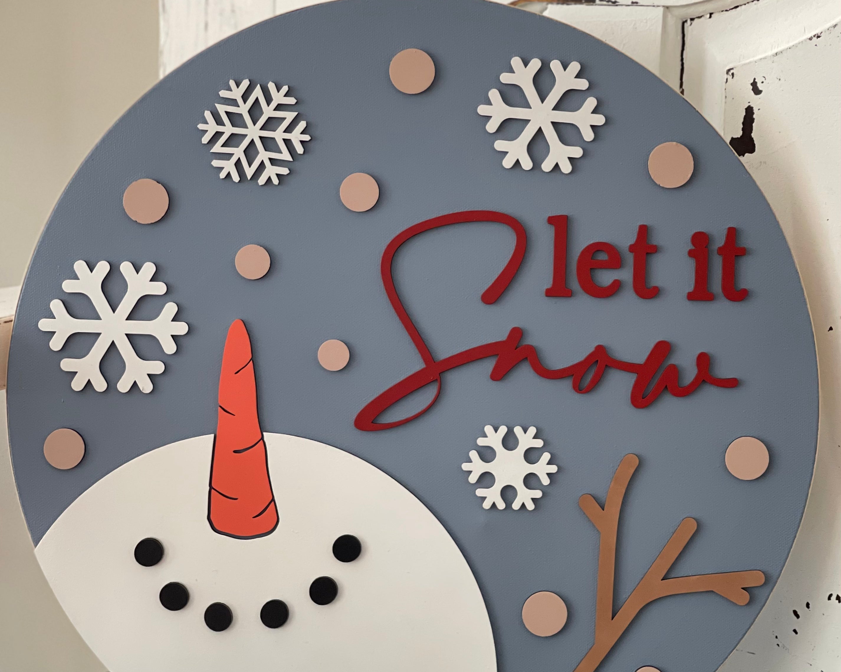 This beautiful 16" round canvas Let It Snow Snowman sign makes a great added decor piece to any home, or as a gift.  All elements are 3D cutouts.  Not intended to be used in direct line of outdoor elements.